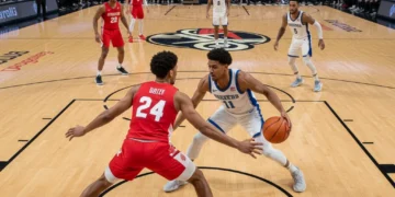 Basketball players demonstrating strong perimeter defense on the court