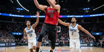 Basketball player shooting a three-pointer, strategic court action