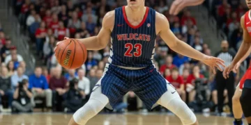 College basketball freshman drives to the basket in a high-stakes game.