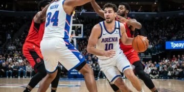 Basketball guard dribbling during a pick-and-roll play, looking for an open pass or shot.