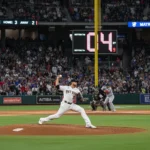 MLB Pitch Clock Impact: Game Length & Pitcher Performance MLB pitcher on mound with pitch clock visible, showing game action