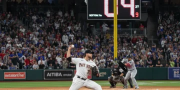 MLB pitcher on mound with pitch clock visible, showing game action