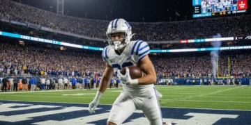 Dynamic college football player in action on a brightly lit field, representing top NFL draft prospects.